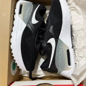 Nike Air Max SYSTM shoe in a black, white, and wolf grey colorway women’s 5.5